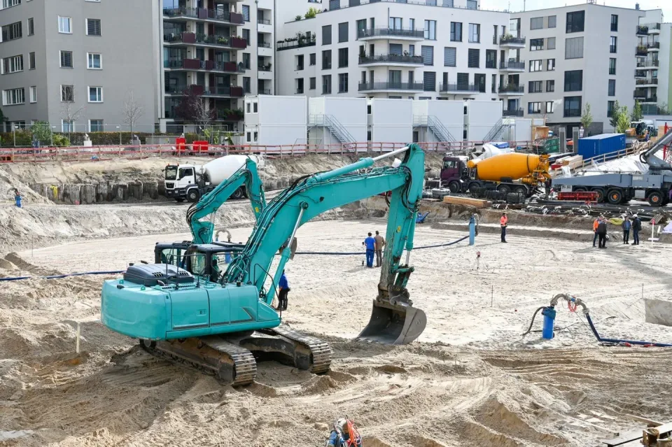 Teal Excavator — Construction Site